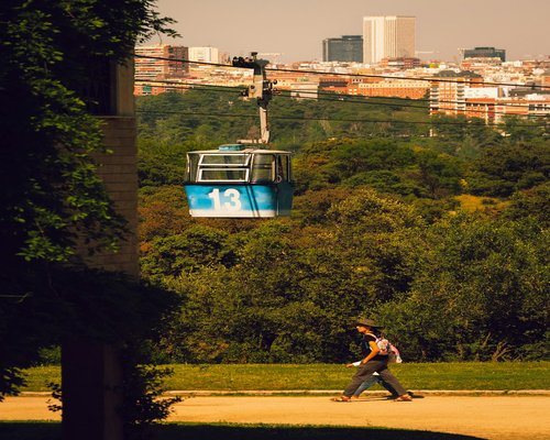 A person taking a gentle walk through a city park in Spain